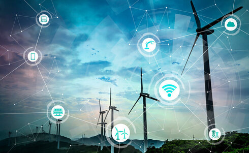 Windkraftanlagen mit digitalen Netzwerksymbolen im Hintergrund.